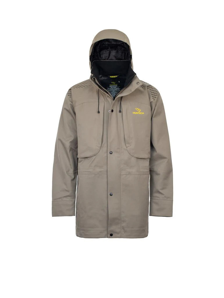 Front view of men’s breathable three-layer jacket with pit zips for heat regulation, YKK 2-way full length zip, thermal retention cuff and three-way adjustable hood. The jacket also features two bellowed chest pockets with the Huntech logo in bright yellow on the left pocket. Ships from Australia and is shown here in sand with the hood up.