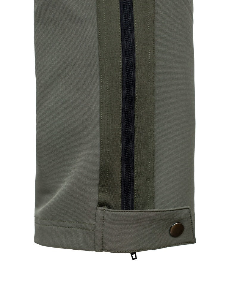 Close up of tab closure across the bottom of the thigh-high zips on the legs of the men's three season hunting pants.