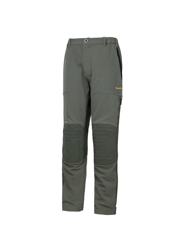 Three quarters front view of men’s three-season hunting pants in customized flexible cotton with oxford polyester knee and dry seat panels. They come with thigh high side zips, and side pockets. Ships from Australia and shown here olive with Huntech logo in bright yellow mid-thigh on the left side.