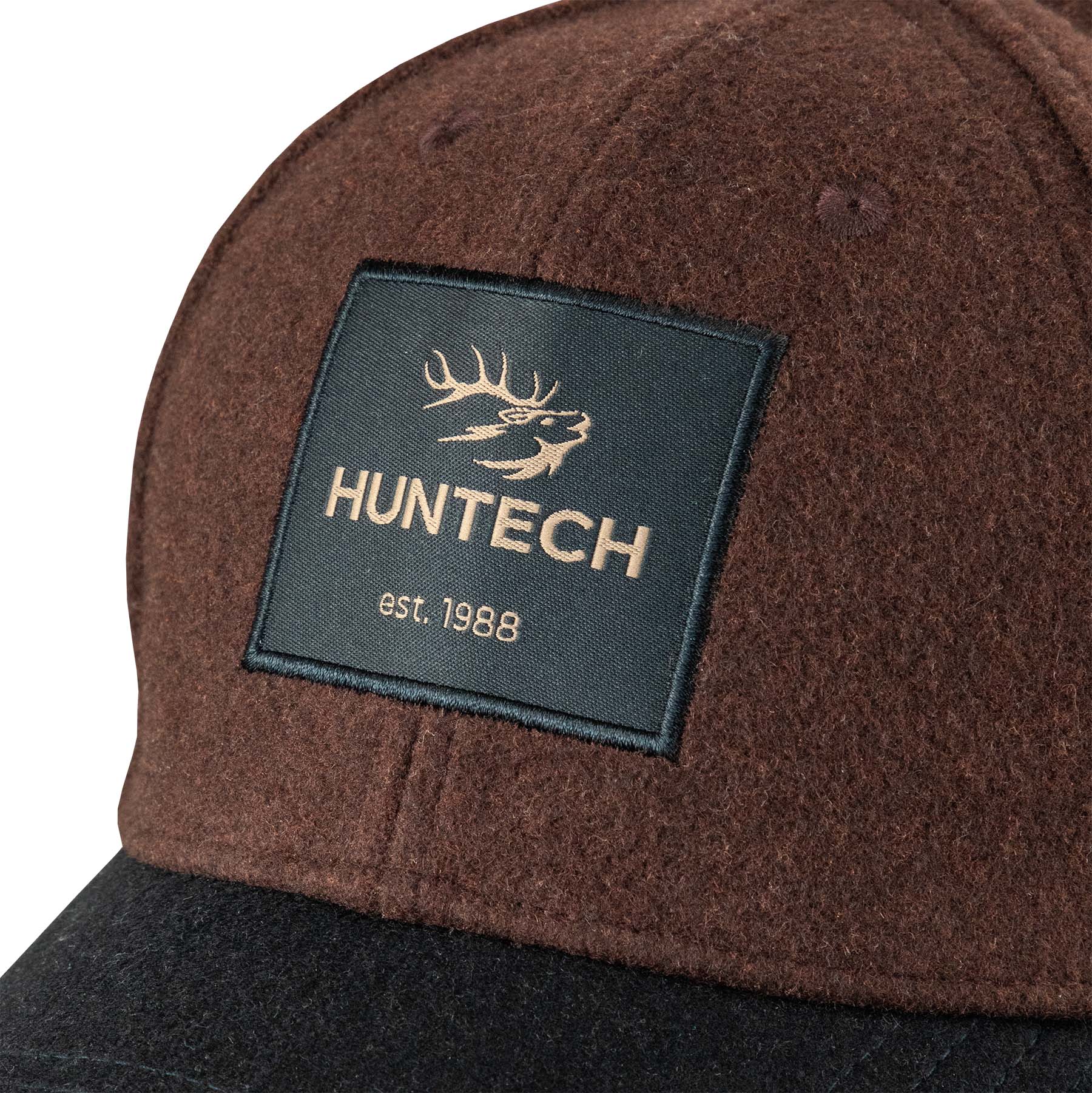 Close up of the Huntech logo on the military green background as it is stitched to the front of the crown.