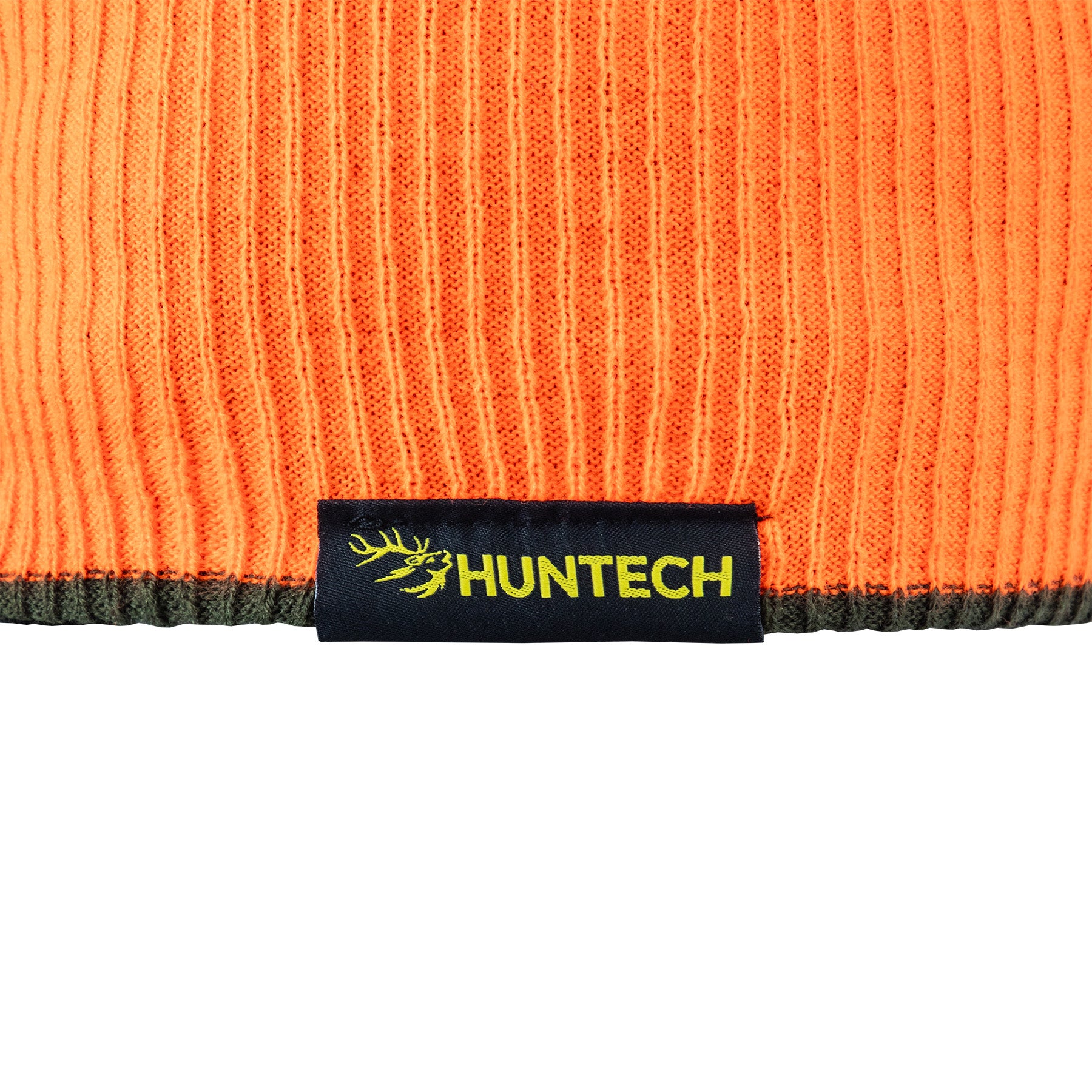 Close up of the Huntech logo in bright yellow on a black tag. Beanie is showing the Blaze side and has a military green lower edge.