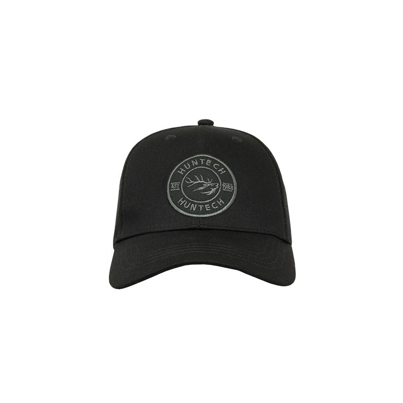 A black cap with an embroidered dark grey Huntech badge on the front, featuring a mid-profile fit with a curved peak.