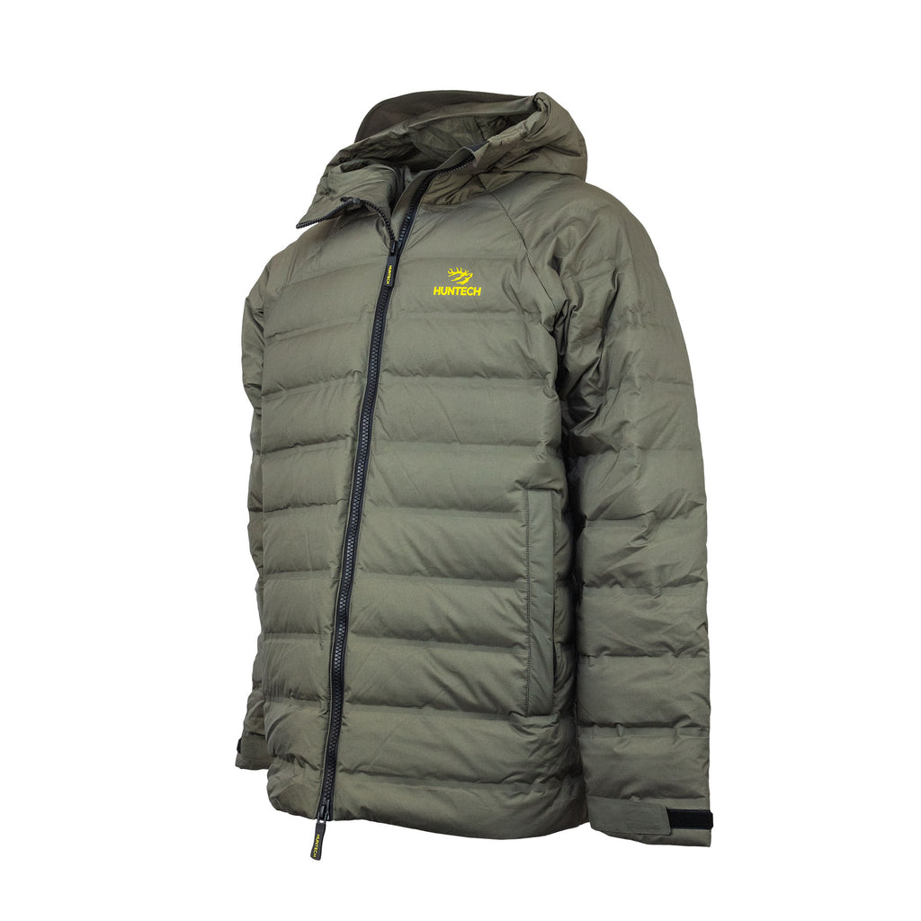 Front view of men’s lightweight, responsible down, waterproof puffer jacket with the Huntech logo in bright yellow on the left breast. With a bonded nylon outer, this fully seam-sealed jacket features a side pocket, a front zip close and adjustable hood as well as adjustable cuffs. Shown here in a dark olive green with the hood down, this product ships from Australia.