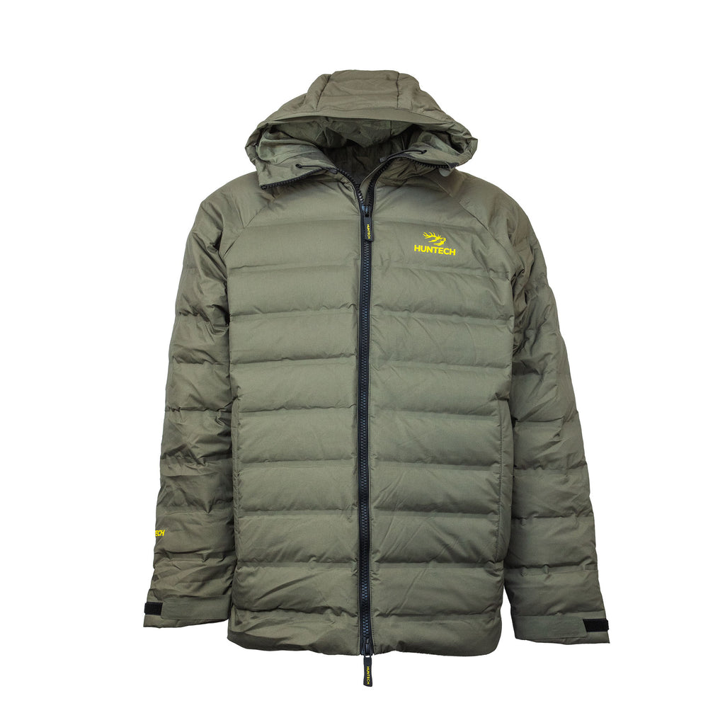 Front view of men’s lightweight, responsible down, waterproof puffer jacket with the Huntech logo in bright yellow on the left breast. With a bonded nylon outer, this fully seam-sealed jacket features a side pocket, a front zip close and adjustable hood as well as adjustable cuffs. Shown here in a dark olive green with the hood down, this product ships from Australia.
