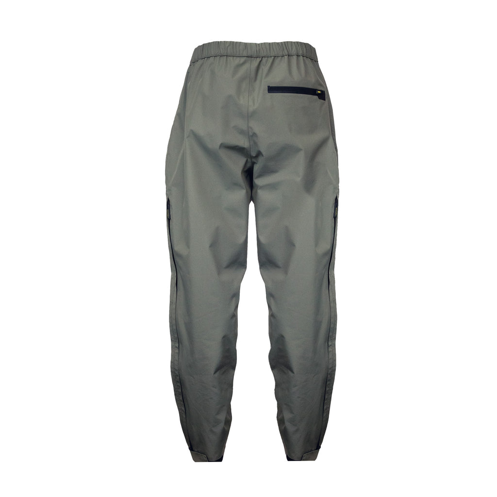 Back view of men’s waterproof pants with back zippered pocket on the right, an elastic waistband and adjustable hems. They ship from Australia and are shown here in a dark olive green/grey.
