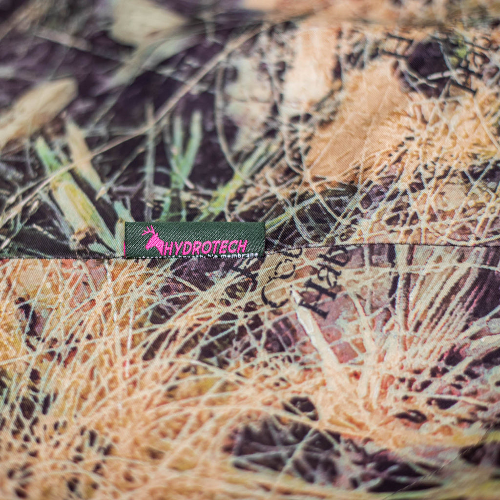 close up of the hydrotech tag with the Huntech stags head in bright pink.