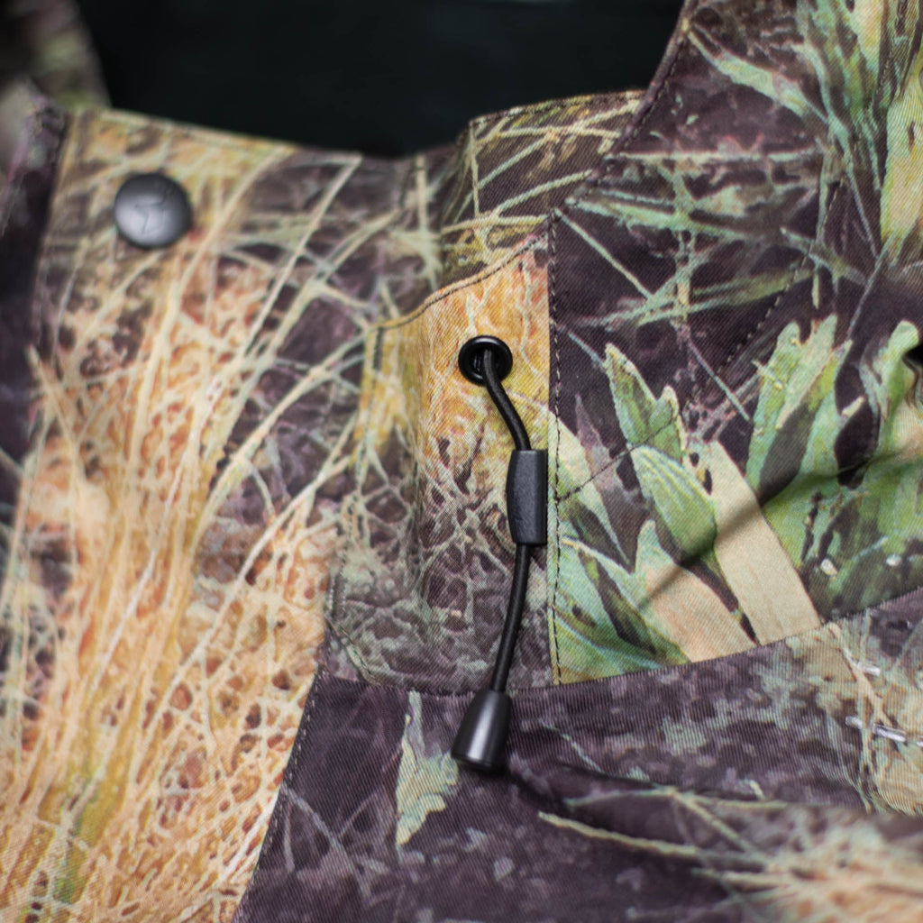 Close up of hood tension system with cord and toggle.