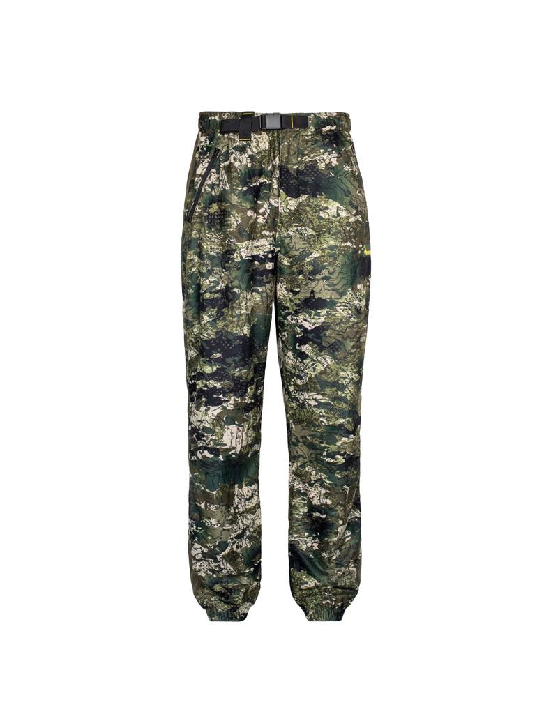Front view of men’s bush pant in 180gsm high grade anti-pill finished fleece with elasticated waistband and internal belt, twin hip zip pockets and elasticated leg opening for comfort and heat retention. Constructed using flatlock reinforced seams for strength and comfort, they features the Huntech logo on the left hand side just below the pocket. Shown in kakariki camo pattern. Ships from Australia.
