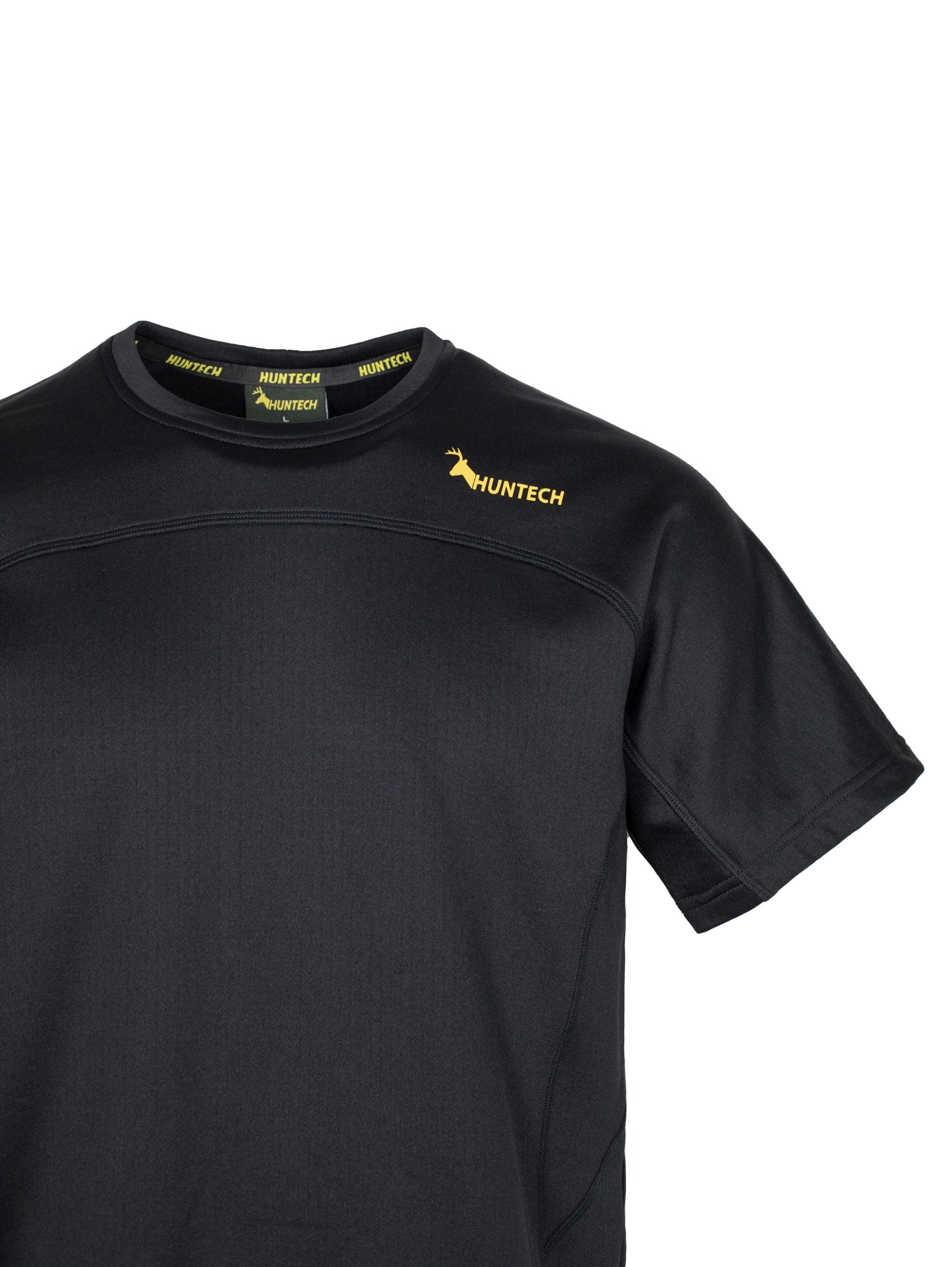 Close up of Huntech logo in yellow on left hand side of yoke just below shoulder line. Top is in black.