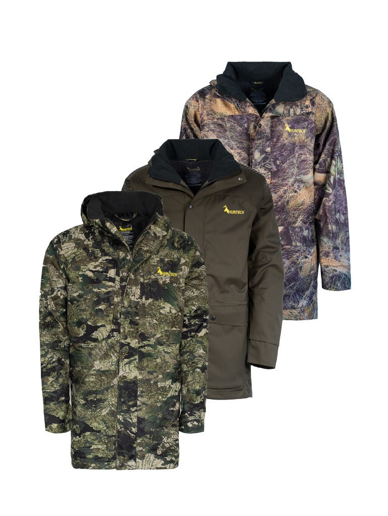 Front view of three men’s breathable three-layer jacket with pit zips for heat regulation, YKK 2-way full length zip, thermal retention cuff and three-way adjustable hood. The jacket also features two bellowed chest pockets with the Huntech logo in bright yellow on the left pocket. Ships from Australia and is shown here from left to right in kakariki camo, military green, and high-country camo.
