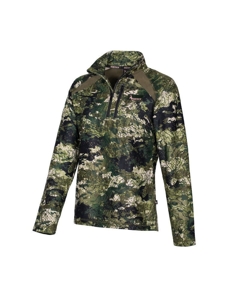 Three quarter view of women’s bush sweatshirt in 180gsm high grade anti-pill finished fleece with turtleneck, half zip entry and protective guard. It is constructed using flatlock reinforced seams for strength and comfort, features the Huntech logo in rose gold on the breast and a scooped back hemline for warmth. Shown in Kakariki camo pattern. Ships from Australia.