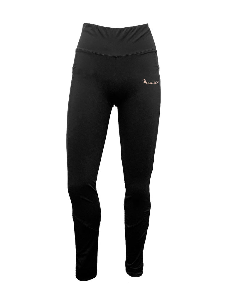 Front view of women’s leggings in nylon/elastane brushed fabric with a wide Basque waistline. Shown here in black with the Huntech logo in rose gold on the left hip, this item ships from Australia.