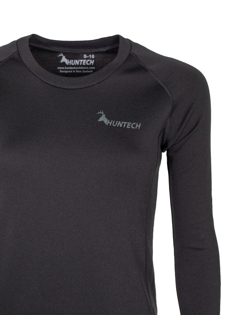 Close up of Huntech logo in grey on left breast of merino long sleeved top.