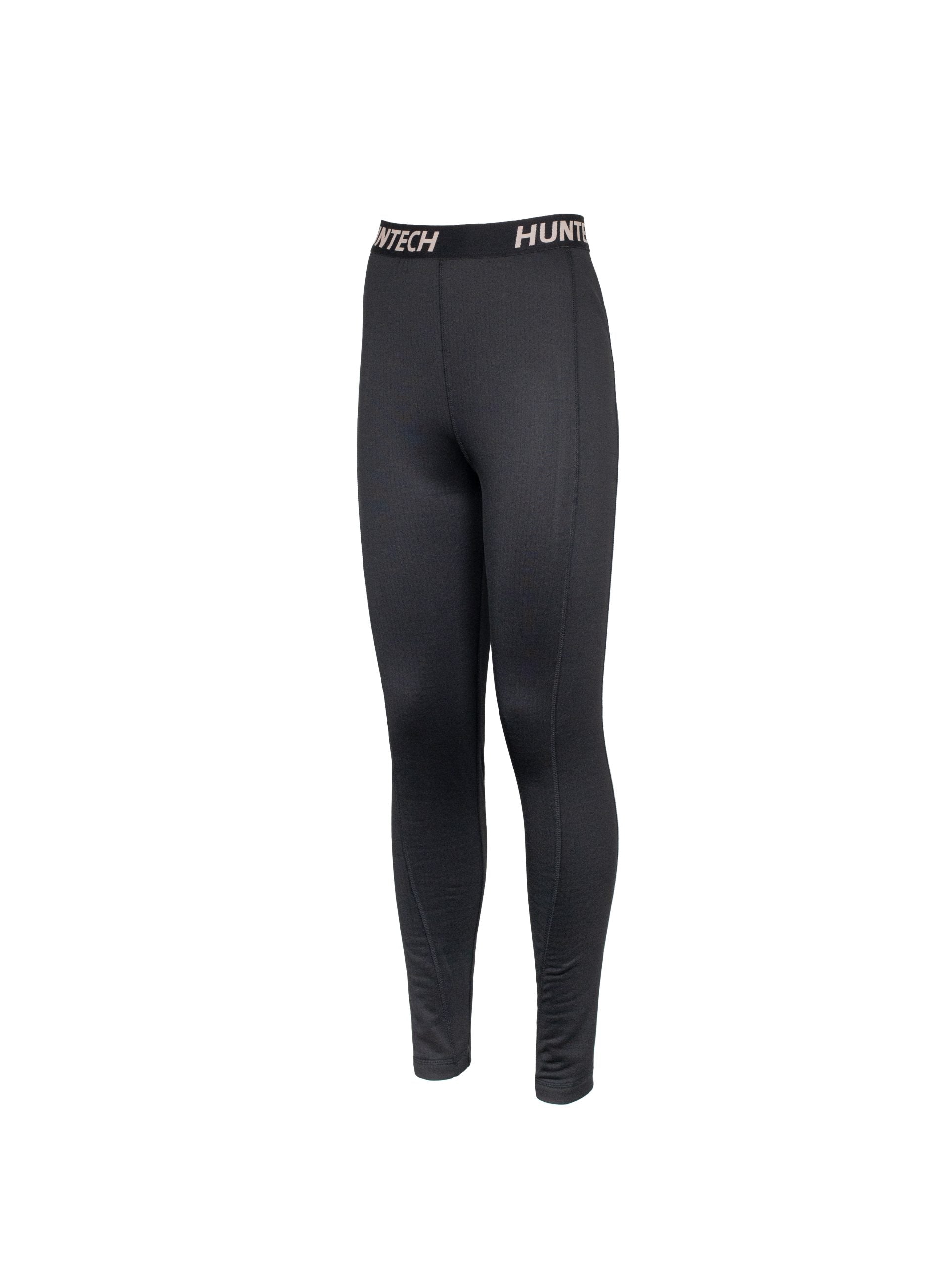 Three quarters front view of women’s snug fit leggings for layering. Easy care highly technical thermal base layer comprising 230 gsm, 94% Recycled Polyester / 6% Spandex fabric, with flat locked seams to minimise skin irritation and articulated panels for performance. Features black elastic waist band with Huntech logo in yellow. Ships from Australia and shown in black.