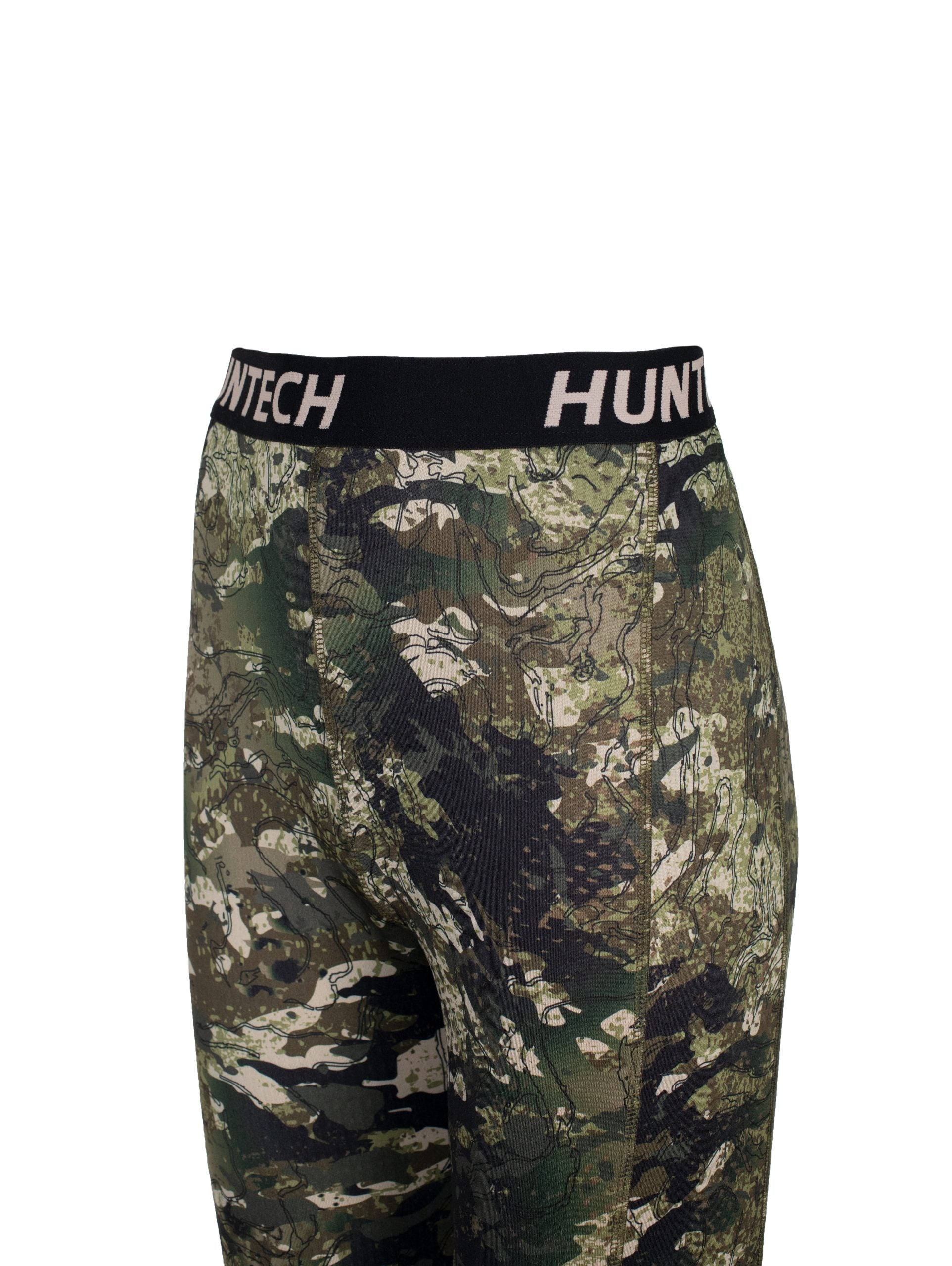 Close up of black waistband with Huntech logo. Shown on kakariki camo pattern leggings.