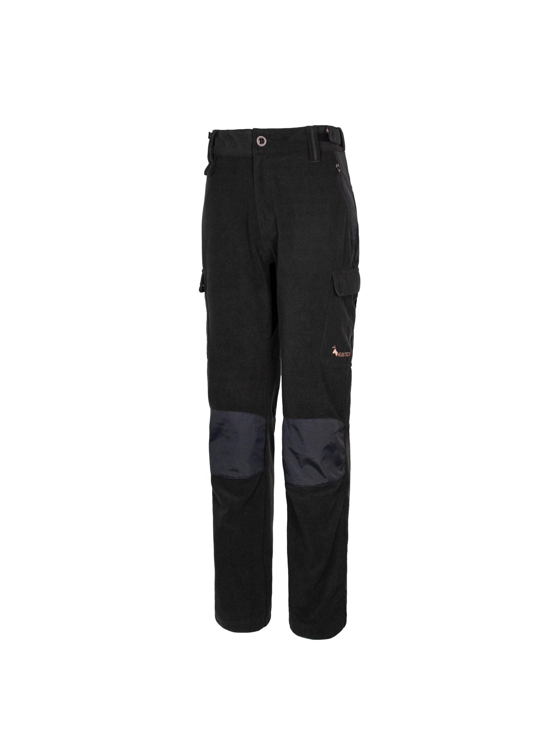 Three quarter front view of women’s mid-weight pants in a brushed tricot, with a flexible spandex crutch, a reinforced Oxford knee and internal waist adjustment system. The Huntech logo appears in rose gold, mid thigh on the left outside leg. Shown in black, this product ships from Australia.
