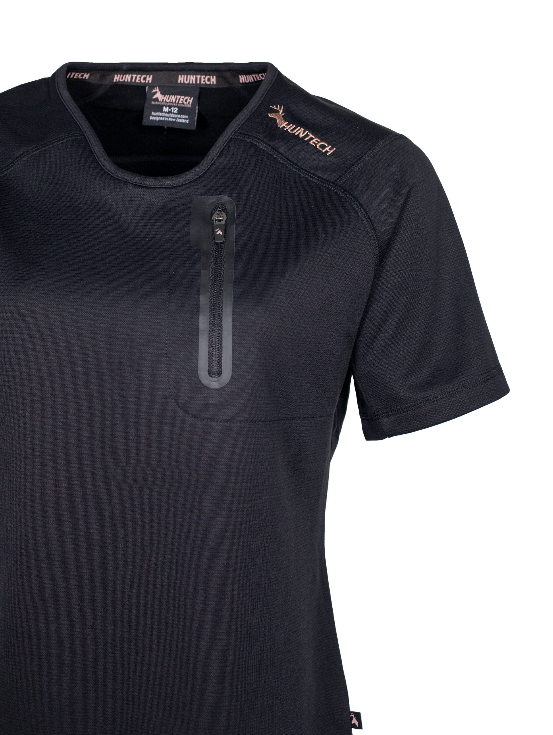 Close up front view of women’s short sleeved tee in flat finish fleece with a bound-edge rounded V-neck. It has a zippered chest pocket with the Huntech logo in rose gold on the shoulder and features Spandex underarm gussets. Shown here in black, this product ships from Australia.