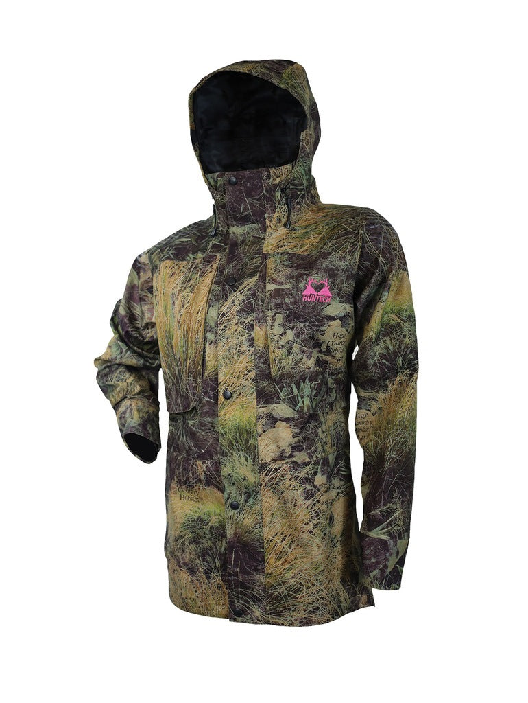 Front view of women’s breathable three-layer jacket with pit zips for heat regulation, YKK 2-way full length zip, thermal retention cuff and three-way adjustable hood. The jacket also features two bellowed chest pockets with the Huntech twin stag logo in bright pink on the left pocket. Ships from Australia and is shown here in high country camo pattern.