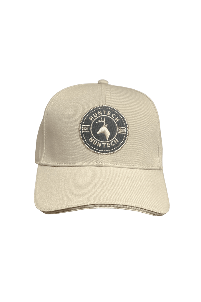 Front shot of cream 6 panel cap comes with a pre-curved brim and Velcro adjustment strap. One size fits most with a classic Huntech badge front and centre on this acrylic twill cap. Ships from Australia.